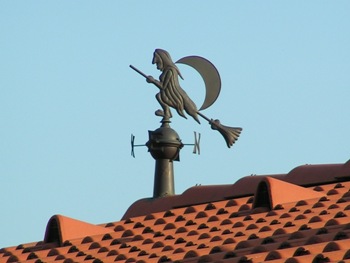 This "witchey" weathervane sits atop a rooftop in Hungary.  Photographer unknown.